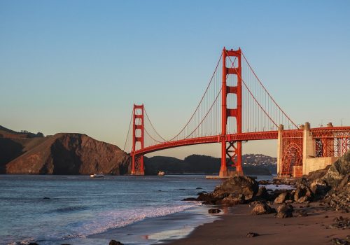 Beautiful shot of The Golden Gate Bridge with clear blue sky and the lake